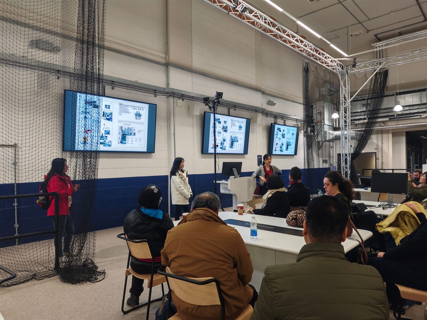Workshop audience in an immersive engineering lab.